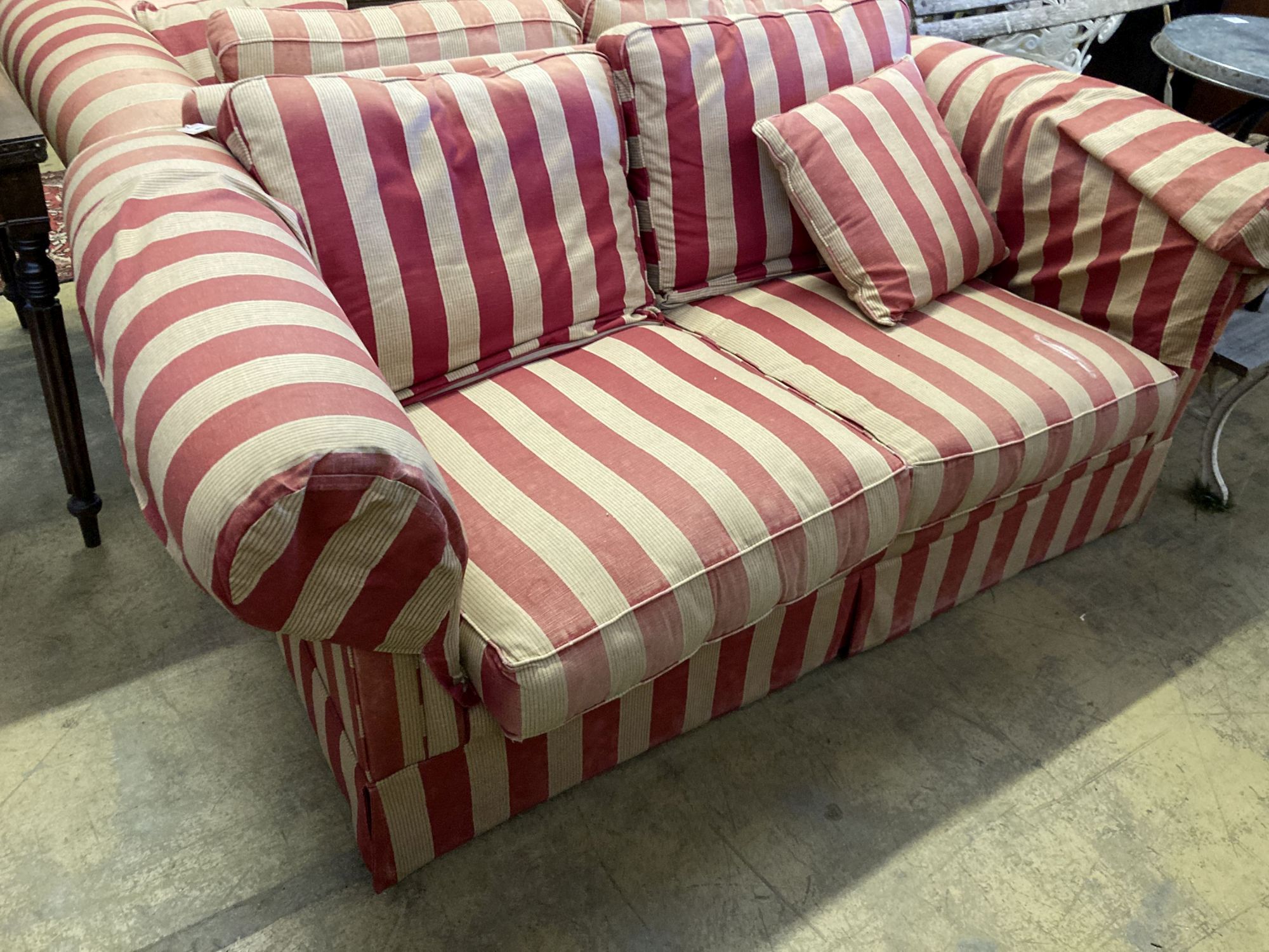A pair of modern Chesterfied settees with red and cream upholstery (upholstery worn), length 178cm, depth 100cm, height 72cm
